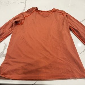Lululemon. Men’s orange long sleeved shirt.  Great condition.